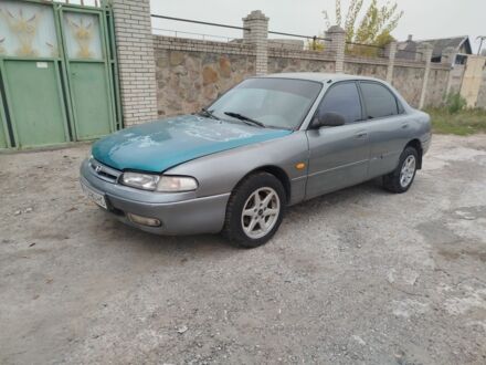 Серый Мазда 626, объемом двигателя 2 л и пробегом 100 тыс. км за 1000 $, фото 1 на Automoto.ua