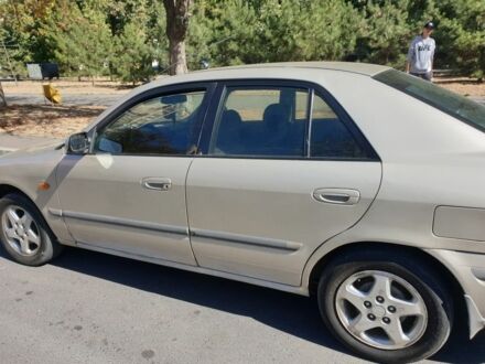 Серый Мазда 626, объемом двигателя 2 л и пробегом 400 тыс. км за 900 $, фото 1 на Automoto.ua