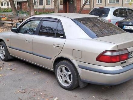 Серый Мазда 626, объемом двигателя 1.8 л и пробегом 320 тыс. км за 3300 $, фото 1 на Automoto.ua