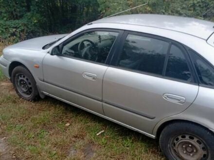 Серый Мазда 626, объемом двигателя 2 л и пробегом 250 тыс. км за 1999 $, фото 1 на Automoto.ua