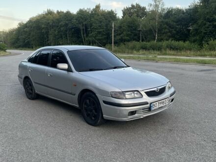 Серый Мазда 626, объемом двигателя 2 л и пробегом 305 тыс. км за 1999 $, фото 1 на Automoto.ua