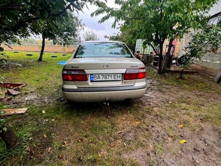 Серый Мазда 626, объемом двигателя 2 л и пробегом 470 тыс. км за 1500 $, фото 1 на Automoto.ua