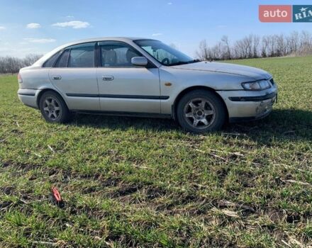 Серый Мазда 626, объемом двигателя 2 л и пробегом 312 тыс. км за 2800 $, фото 1 на Automoto.ua