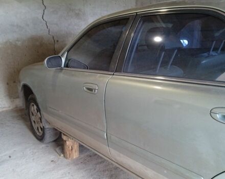 Серый Мазда 626, объемом двигателя 2 л и пробегом 450 тыс. км за 800 $, фото 1 на Automoto.ua