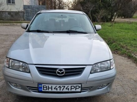 Серый Мазда 626, объемом двигателя 2 л и пробегом 230 тыс. км за 4500 $, фото 1 на Automoto.ua