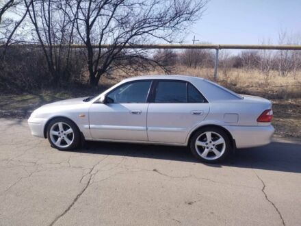 Серый Мазда 626, объемом двигателя 1.8 л и пробегом 290 тыс. км за 3100 $, фото 1 на Automoto.ua