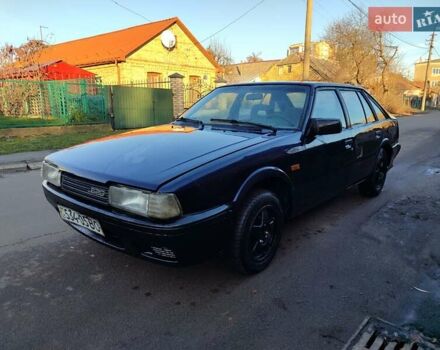 Синій Мазда 626, об'ємом двигуна 2 л та пробігом 300 тис. км за 750 $, фото 1 на Automoto.ua