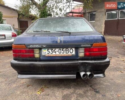 Синий Мазда 626, объемом двигателя 2 л и пробегом 400 тыс. км за 700 $, фото 1 на Automoto.ua