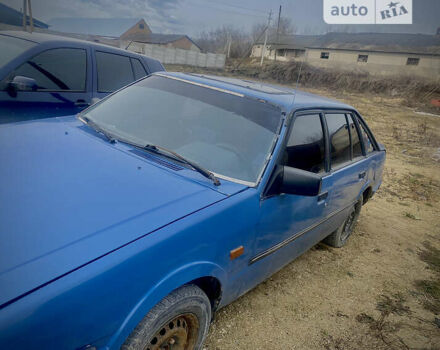 Синий Мазда 626, объемом двигателя 2 л и пробегом 300 тыс. км за 650 $, фото 2 на Automoto.ua