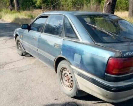 Синий Мазда 626, объемом двигателя 2 л и пробегом 300 тыс. км за 650 $, фото 1 на Automoto.ua
