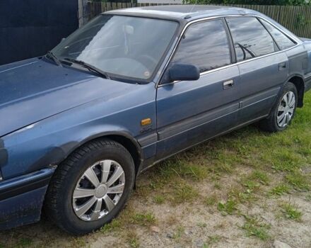 Синий Мазда 626, объемом двигателя 2 л и пробегом 200 тыс. км за 500 $, фото 1 на Automoto.ua
