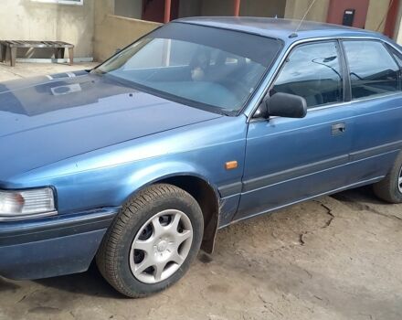 Синий Мазда 626, объемом двигателя 2 л и пробегом 300 тыс. км за 985 $, фото 1 на Automoto.ua