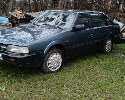 Синий Мазда 626, объемом двигателя 2 л и пробегом 205 тыс. км за 600 $, фото 1 на Automoto.ua