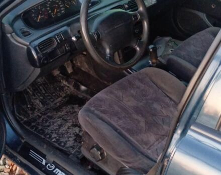 Синий Мазда 626, объемом двигателя 1.8 л и пробегом 430 тыс. км за 1100 $, фото 2 на Automoto.ua