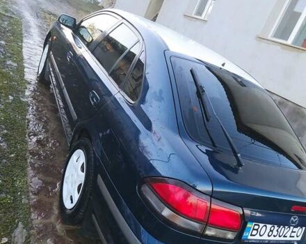 Синий Мазда 626, объемом двигателя 2 л и пробегом 280 тыс. км за 1999 $, фото 5 на Automoto.ua