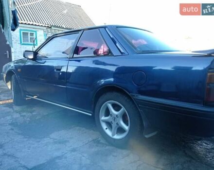 Синий Мазда 626, объемом двигателя 2 л и пробегом 370 тыс. км за 950 $, фото 1 на Automoto.ua