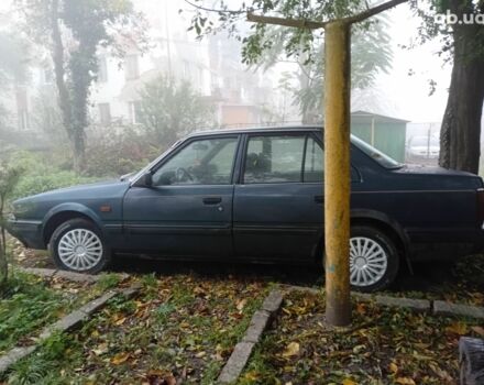 Синий Мазда 626, объемом двигателя 2 л и пробегом 387 тыс. км за 1500 $, фото 6 на Automoto.ua