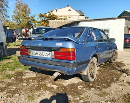 Синий Мазда 626, объемом двигателя 1.6 л и пробегом 100 тыс. км за 200 $, фото 1 на Automoto.ua