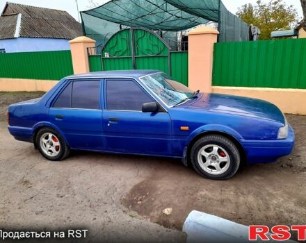 Синий Мазда 626, объемом двигателя 2 л и пробегом 403 тыс. км за 1000 $, фото 3 на Automoto.ua