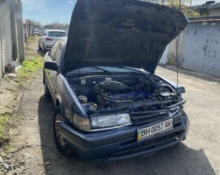 Синий Мазда 626, объемом двигателя 1.8 л и пробегом 150 тыс. км за 650 $, фото 1 на Automoto.ua