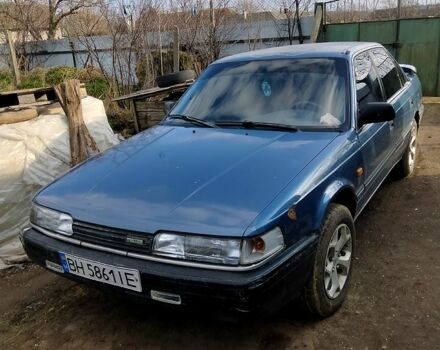 Синий Мазда 626, объемом двигателя 2 л и пробегом 328 тыс. км за 1100 $, фото 1 на Automoto.ua