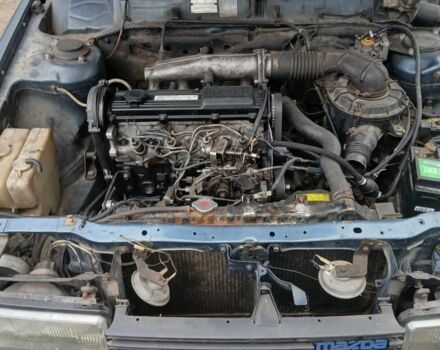 Синий Мазда 626, объемом двигателя 2 л и пробегом 292 тыс. км за 500 $, фото 2 на Automoto.ua