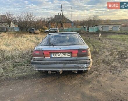 Синій Мазда 626, об'ємом двигуна 2 л та пробігом 300 тис. км за 714 $, фото 5 на Automoto.ua