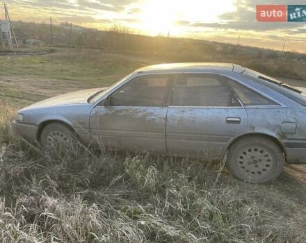 Синій Мазда 626, об'ємом двигуна 2 л та пробігом 300 тис. км за 714 $, фото 6 на Automoto.ua