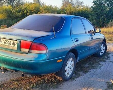 Синий Мазда 626, объемом двигателя 2 л и пробегом 442 тыс. км за 600 $, фото 1 на Automoto.ua
