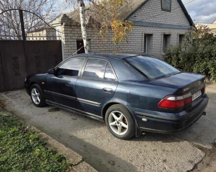 Синий Мазда 626, объемом двигателя 2 л и пробегом 300 тыс. км за 2300 $, фото 1 на Automoto.ua