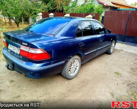 Синий Мазда 626, объемом двигателя 1.8 л и пробегом 88 тыс. км за 1750 $, фото 3 на Automoto.ua