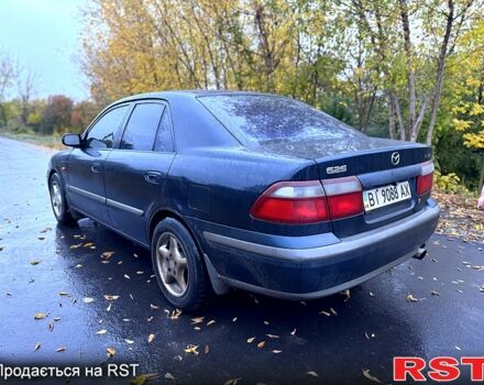 Синий Мазда 626, объемом двигателя 2 л и пробегом 200 тыс. км за 2750 $, фото 3 на Automoto.ua