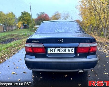 Синий Мазда 626, объемом двигателя 2 л и пробегом 200 тыс. км за 2750 $, фото 2 на Automoto.ua