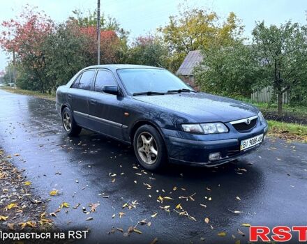 Синий Мазда 626, объемом двигателя 2 л и пробегом 200 тыс. км за 2750 $, фото 1 на Automoto.ua