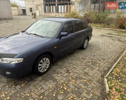 Синий Мазда 626, объемом двигателя 1.8 л и пробегом 395 тыс. км за 1500 $, фото 2 на Automoto.ua