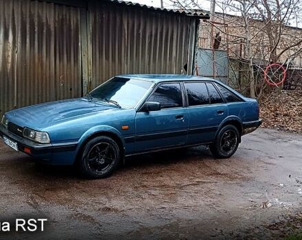 Синій Мазда 626, об'ємом двигуна 2 л та пробігом 348 тис. км за 2000 $, фото 1 на Automoto.ua