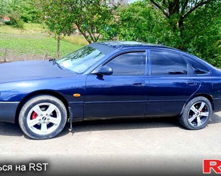 Синій Мазда 626, об'ємом двигуна 1.8 л та пробігом 200 тис. км за 1750 $, фото 3 на Automoto.ua