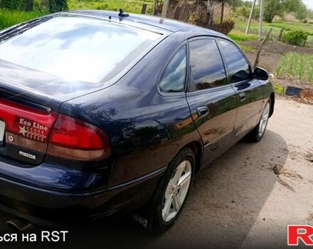 Синій Мазда 626, об'ємом двигуна 1.8 л та пробігом 200 тис. км за 1750 $, фото 6 на Automoto.ua