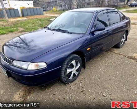 Синий Мазда 626, объемом двигателя 1.8 л и пробегом 300 тыс. км за 1600 $, фото 1 на Automoto.ua