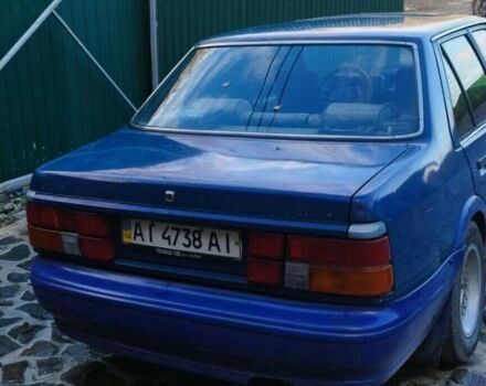 Синий Мазда 626, объемом двигателя 2 л и пробегом 300 тыс. км за 550 $, фото 1 на Automoto.ua