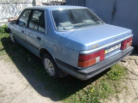 Синий Мазда 626, объемом двигателя 1.6 л и пробегом 300 тыс. км за 700 $, фото 1 на Automoto.ua