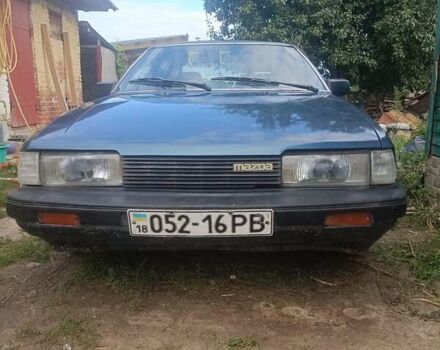 Синий Мазда 626, объемом двигателя 2 л и пробегом 295 тыс. км за 850 $, фото 1 на Automoto.ua
