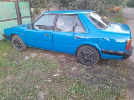 Синий Мазда 626, объемом двигателя 2 л и пробегом 256 тыс. км за 692 $, фото 1 на Automoto.ua