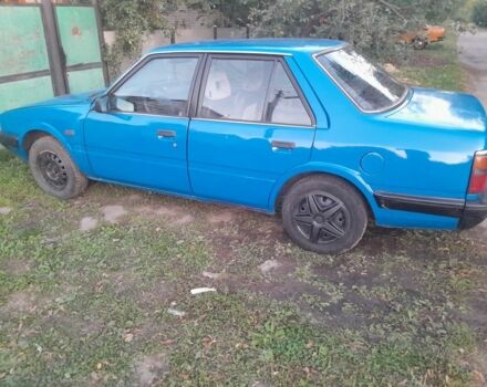 Синій Мазда 626, об'ємом двигуна 2 л та пробігом 256 тис. км за 692 $, фото 1 на Automoto.ua
