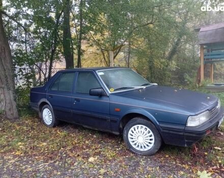 Синий Мазда 626, объемом двигателя 2 л и пробегом 387 тыс. км за 1500 $, фото 1 на Automoto.ua