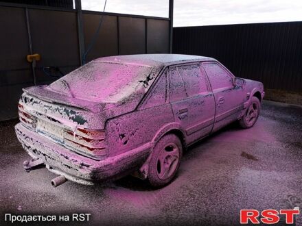 Синий Мазда 626, объемом двигателя 2 л и пробегом 500 тыс. км за 500 $, фото 1 на Automoto.ua