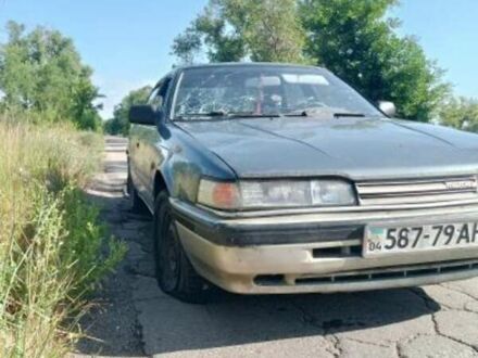 Синий Мазда 626, объемом двигателя 2 л и пробегом 300 тыс. км за 650 $, фото 1 на Automoto.ua