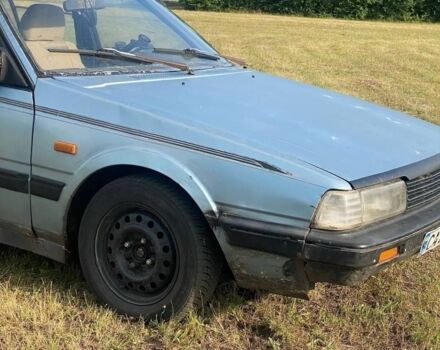 Синий Мазда 626, объемом двигателя 2 л и пробегом 512 тыс. км за 700 $, фото 1 на Automoto.ua