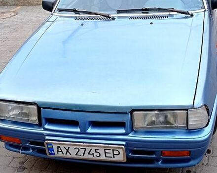 Синий Мазда 626, объемом двигателя 2 л и пробегом 455 тыс. км за 700 $, фото 1 на Automoto.ua