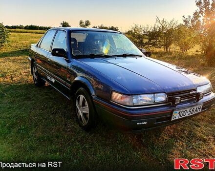 Синий Мазда 626, объемом двигателя 2 л и пробегом 200 тыс. км за 800 $, фото 1 на Automoto.ua